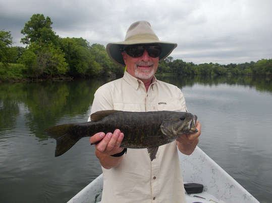Steve Hall holding a 18" smallmouth bass.